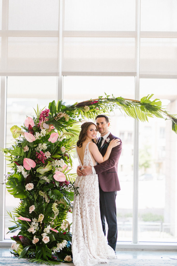 Hawaiian floral arch by Denver wedding florist
